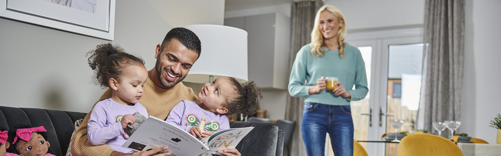 Family reading in lounge
