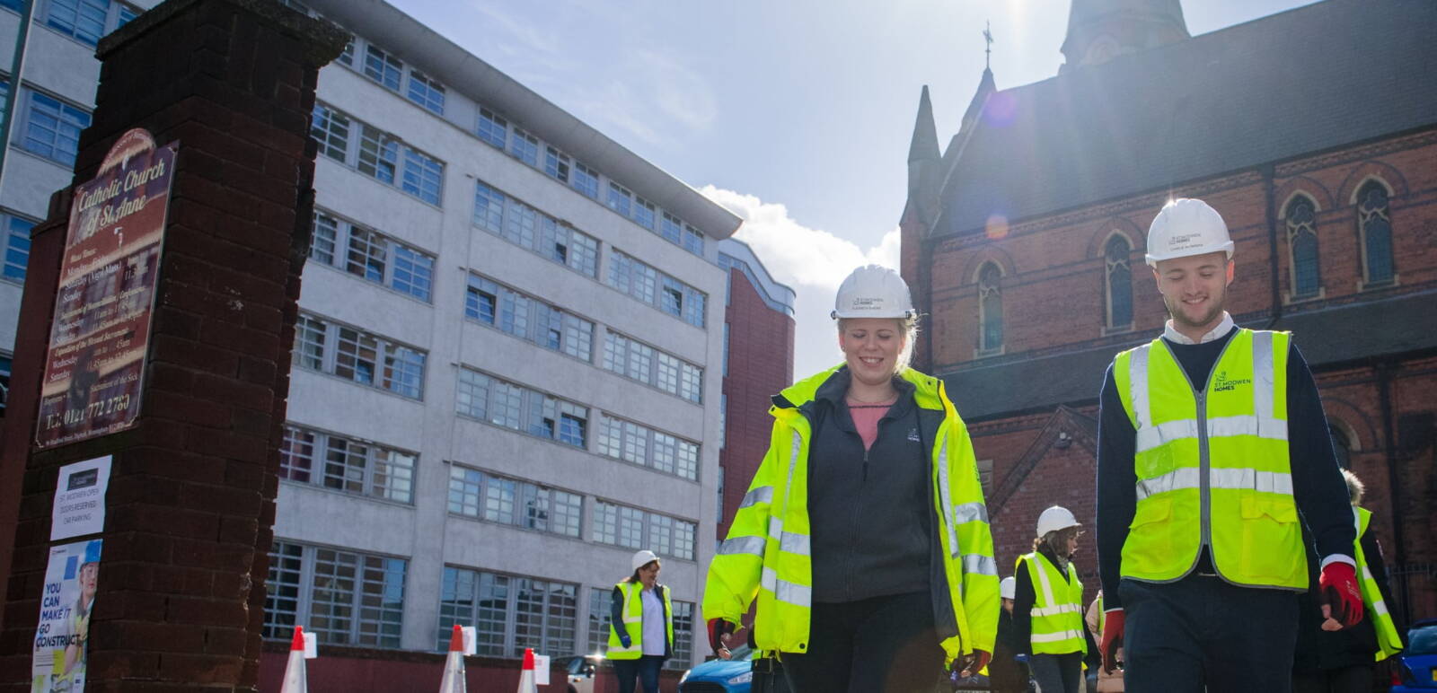 Construction workers outside church